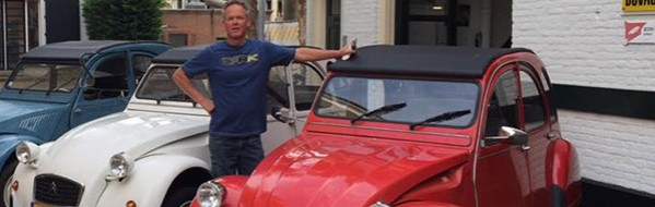 Gerard in front of the garage at the Floraplein, with the classic cars